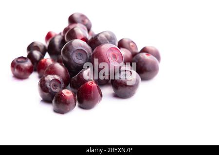 close up of a heap of large fresh huckleberries isolated on a white background Stock Photo