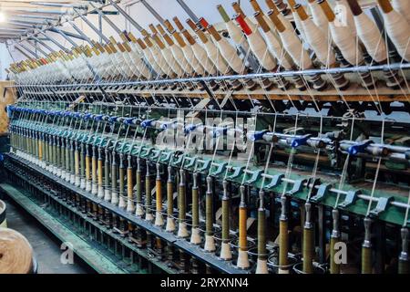 Spinning machinery with spindles Stock Photo