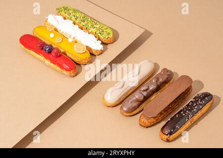 A set of delicious glazed donuts in a variety of flavors, arranged on a cardboard paper in an inviting display Stock Photo