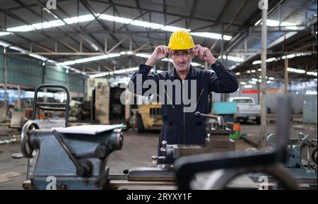 Senior engineer with fatigue from long and hard work Stock Photo