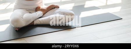 Flexible sport asian woman warming upÂ Fitness woman doing stretch exercise stretching exercising Fitness healthy relaxation Hom Stock Photo