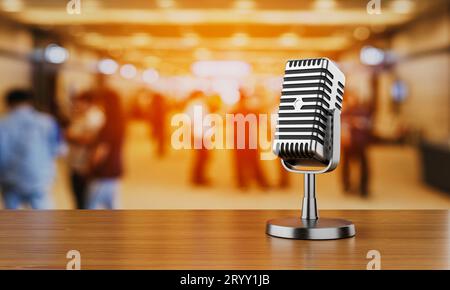 Close up of old vintage style podcast microphone in convention hall and blurry people background. Entertainment and conference c Stock Photo