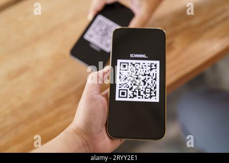 Qr code payment. E wallet. Man scanning tag accepted generate digital pay without money.scanning QR code online shopping cashles Stock Photo