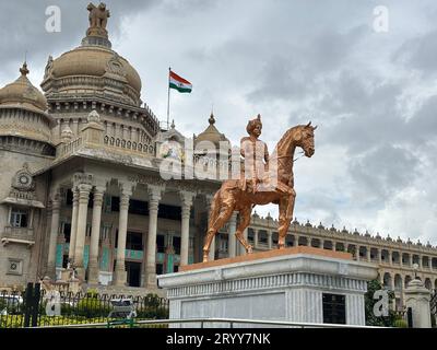Exclusive day shots of Vidhana Soudha building with traffic on a overcast day Stock Photo