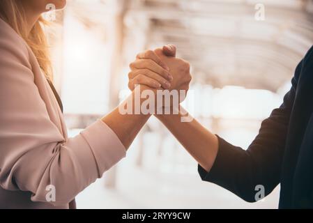 Business partnership meeting trust handshaking concept. Businesswomen doing arm wrestling. Successful business people contract p Stock Photo