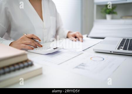 Business woman Accountant investment risk analysis. saving money for Stock market trading with calculator. Accountancy Concept. Stock Photo