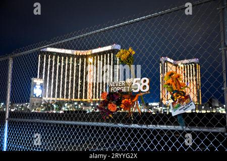Las Vegas, Nevada, USA. 1st Oct, 2023. Memorial signs are seen at the site of the 2017 Las Vegas mass shooting on October 1, 2023, in Las Vegas, Nevada. Approximately 150 people braved the unexpected rain and cold wind at the former Las Vegas Village to honor and remember the 58 people who were killed six years ago by a lone gunman during the Route 91 Harvest Music Festival from the 32nd story of Mandalay Bay Resort and Casino on October 1, 2017. Fifty-eight people died initially with two additional people dying later due to their injuries, making the incident the deadliest mass shooting by Stock Photo