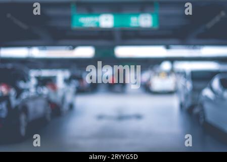 Blurry of car parking lots at department store. Abstract and transportation concept. Dark and low key tone Stock Photo