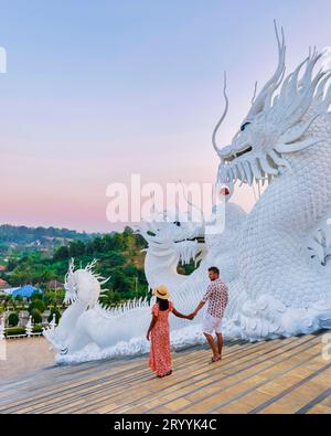 Couple visit Wat Huay Pla Kang Chiang Rai Thailand, Big Budha temple in Chiang Rai Stock Photo