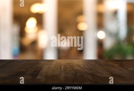 Wood Table Top in Blur Background room interior with empty copy space. Stock Photo