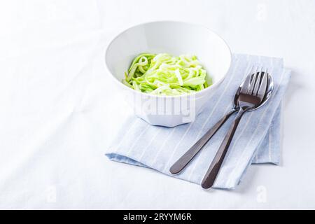 Healthy Zucchini Noddles with pesto Stock Photo