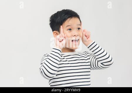 Portrait of cheerful boy with good idea Stock Photo