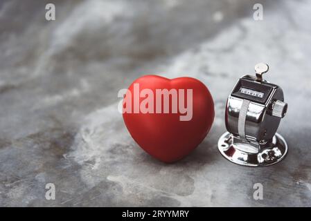 Heart and countdown counter on marble table surface. Medical and health care concept. Life left and remaining and  counter is ze Stock Photo