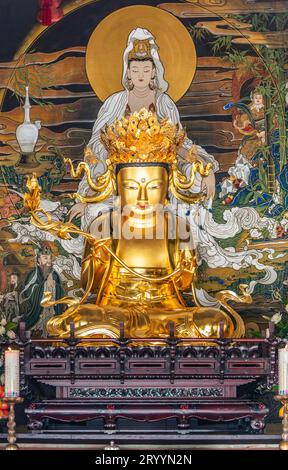 A statue of Buddha in a temple hall Stock Photo