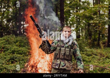 Angry terrorist militant guerrilla soldier warrior in forest Stock Photo