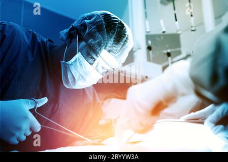 Doctor and assistant nurse operating for rescue patient from dangerous emergency case. Hospital and Surgery Concept. Health care Stock Photo