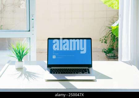 Laptop showing Blue screen of death or BSOD on the monitor screen. Faulty Microsoft operating system Windows 10. Rosario, Argentina - December 23, 202 Stock Photo