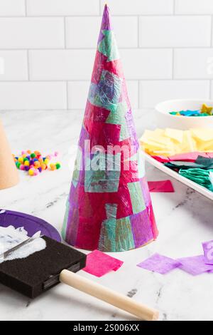 Crafting setup for tissue paper cone Christmas trees Stock Photo