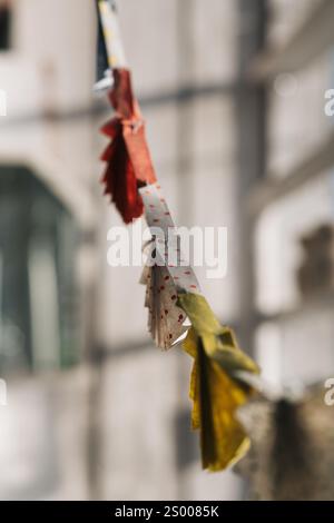 colourful paper fan bunting hanging in a window Stock Photo