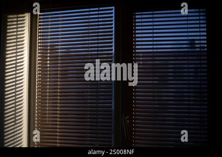 Light through the blinds. Window details. Interior of the apartment. Stock Photo