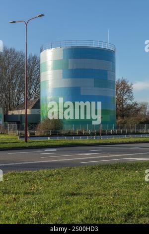 Nieuwegein, the Netherlands 30 November 2024. Heat buffer Nieuwegein, Utrecht. The boiler is painted in camouflage colours white, blue and green, so a Stock Photo