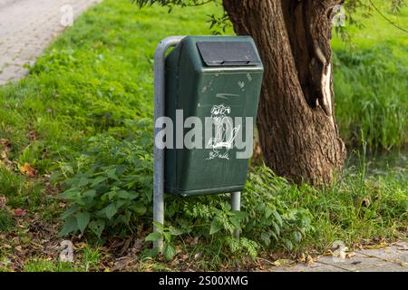 Utrecht, the Netherlands. 26 October 2024. Dog waste bin along a road where dog owners can deposit a bag of excrement. Stock Photo