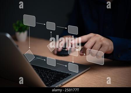 Person interacting with a holographic workflow diagram on a laptop. Represents task management, decision-making, and process organization. Stock Photo