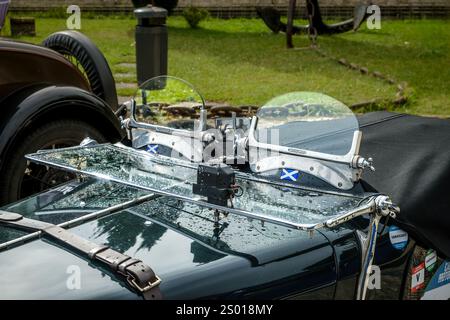 Lisbon, Portugal - Oct 15, 2023: Close-up of front side of classic pre-war car windscreen and hood with hood belt. MG K-Type Magnette, K3 version, by MG car company Ltd, UK, open tourer class of sports car of 1930s, selective focus Stock Photo