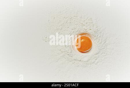 Flour, with egg yolk, texture, food background, top view, pasta, no people Stock Photo