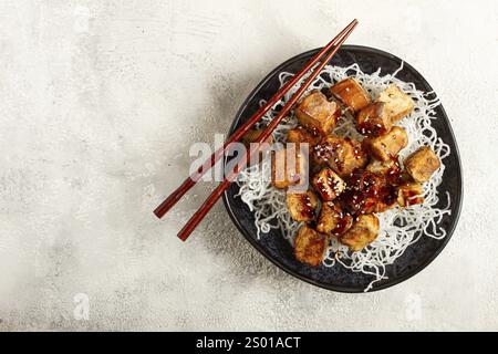 Fried eggplant, with funchosa noodles, with teriyaki sauce and sesame seeds, homemade, no people Stock Photo