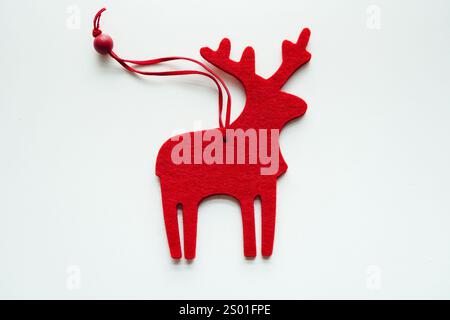 Felt Red Christmas reindeer ornament on white background Stock Photo