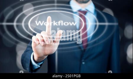 Businessman is pressing button on touch screen interface and selecting workflow. Stock Photo