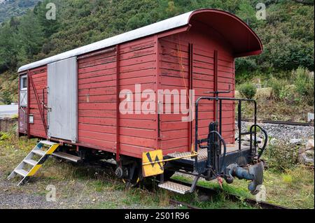 Old abandon wooden boxcar in the Swiss Alps Stock Photo