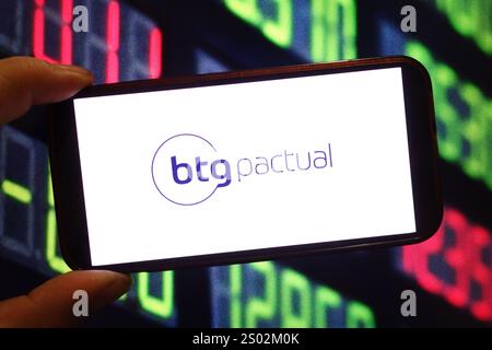 In this photo illustration, the logo of BTG Pactual is seen displayed ...