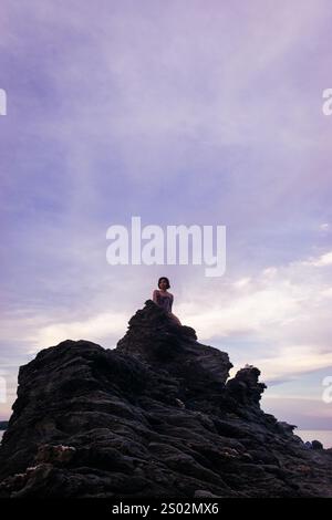 Silhouette of a person on top of a rock. Portrait. Romblon, Philippines Stock Photo