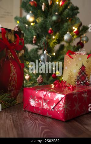 Wrapped gifts under the Christmas tree Stock Photo