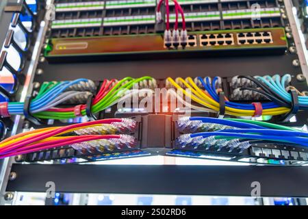 network cable connecting on network core switch close up Stock Photo
