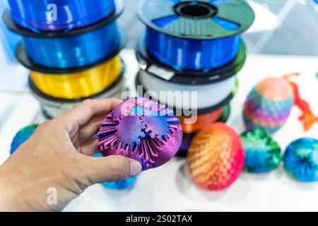 hand with gear object printed on 3d printer close-up Stock Photo