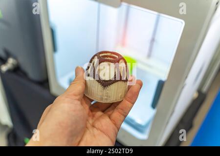 hand with hollow sphere object printed on 3d printer close-up Stock Photo