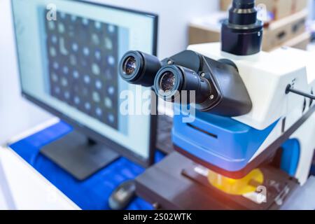 Silicon wafer with semiconductor microchip on machine process examining testing in microscope. Stock Photo