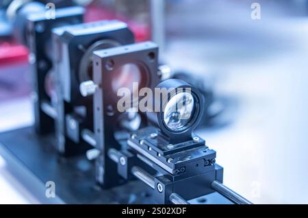 Experiment with laser device in optical laboratory Stock Photo