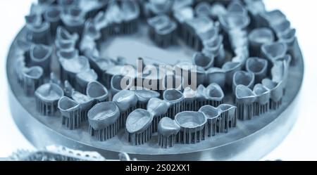 Tooth dental crowns created on 3d printer for metal Stock Photo