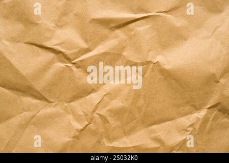 Wrinkled recycled paper background covering the entire frame Stock Photo