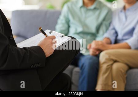 Close up of Psychologist Hands in Family Psychotherapy Session Stock Photo