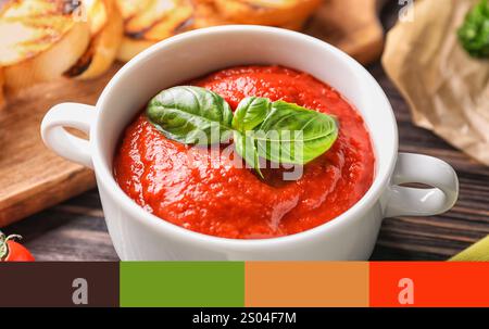 Pot of delicious ketchup on table, closeup. Different color patterns Stock Photo