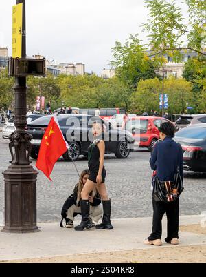 Three women with Peoples Republic of China flag in  photo shoot in Paris , France Stock Photo