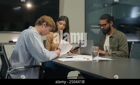 Business people multiracial diverse colleagues partners businessmen businesswoman at table work team in office group coworkers employees creative Stock Photo