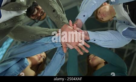 Happy business women men multiracial friends students group corporate colleagues stacking hands in pile join team gesture unity teamwork support girls Stock Photo