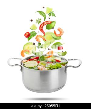 Vegetables and shrimps for soup and pot in air on white background Stock Photo
