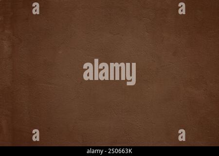 Texture of old rough brown wall. Dark brown concrete wall. Stock Photo